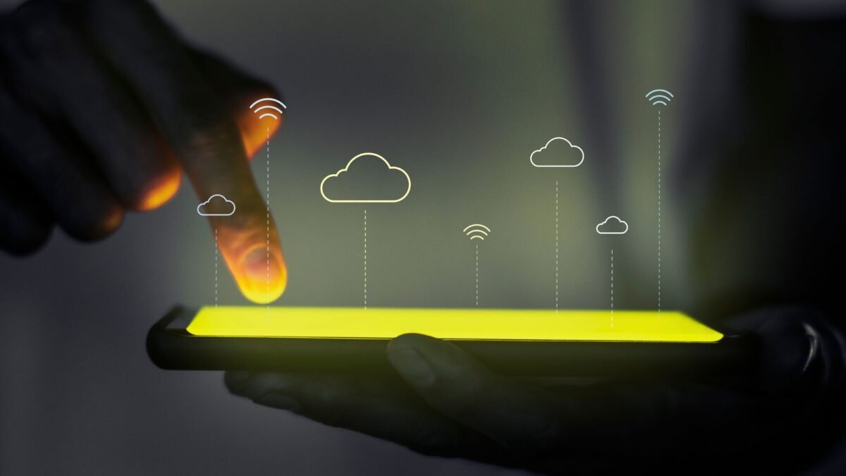 A man is using the cloud migration services and app modernisation on his tablet
